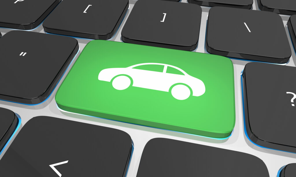 Green keyboard key with car icon symbolizing digital and omnichannel auto shopping experience for credit union members.
