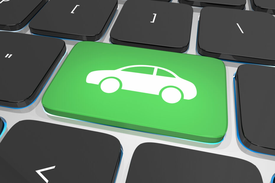 Green keyboard key with car icon symbolizing digital and omnichannel auto shopping experience for credit union members.